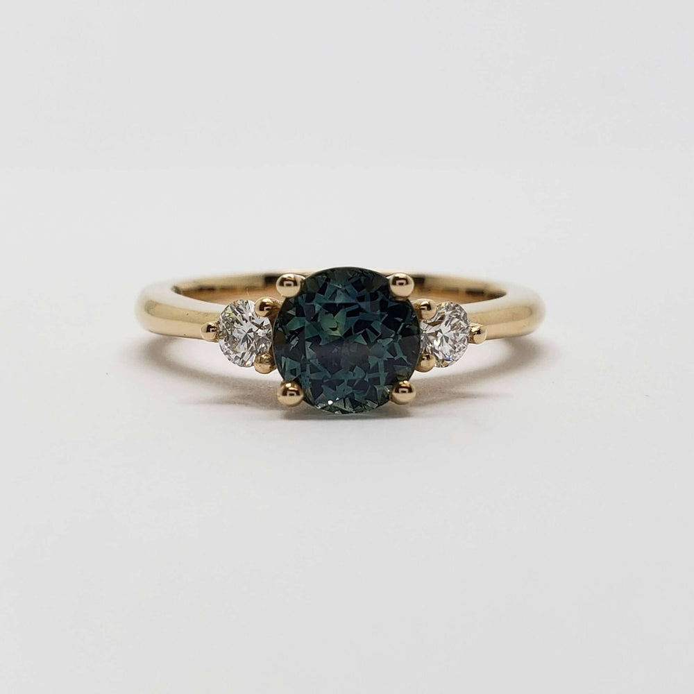 Front view of 14kt yellow gold ring with teal Australian sapphire and lab diamonds