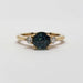 Front view of 14kt yellow gold ring with teal Australian sapphire and lab diamonds