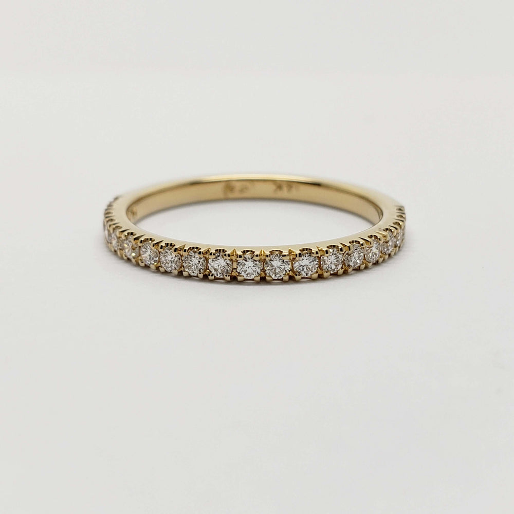 Front view of 14kt yellow gold wedding ring with pave-set lab diamonds