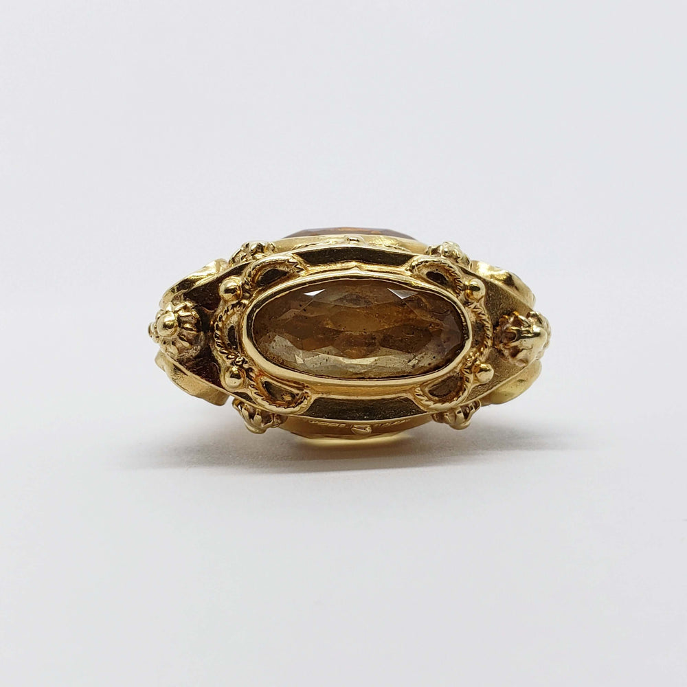 Front view of antique 18kt yellow gold fob pendant with bezel-set oval citrine