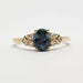 Front view of 14kt yellow gold ring with teal Montana sapphire and diamond accents
