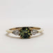 Front view of 14kt yellow gold ring with green-yellow Montana sapphire and lab diamonds