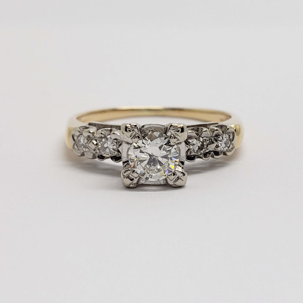 Front view of antique diamond engagement ring with illusion-set centre in 14kt gold