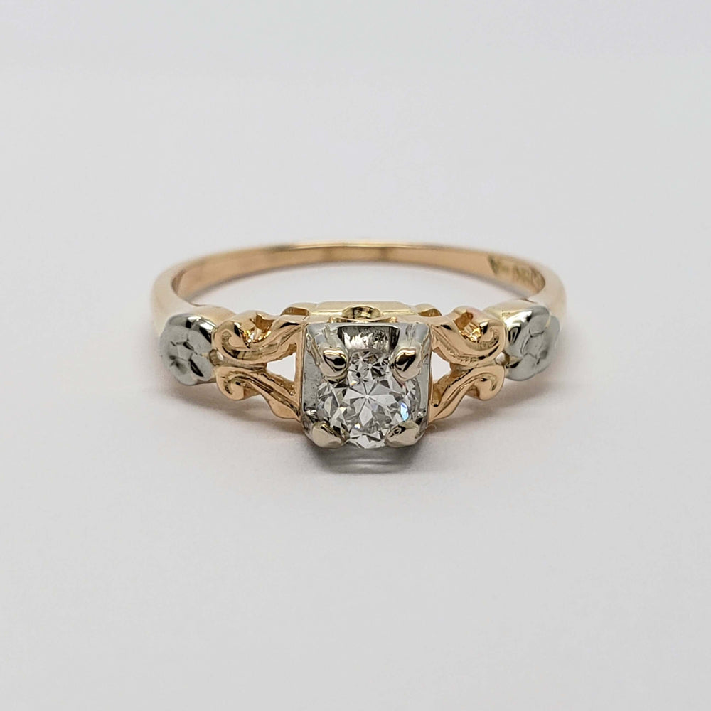 Front view of antique floral diamond ring in yellow and white gold