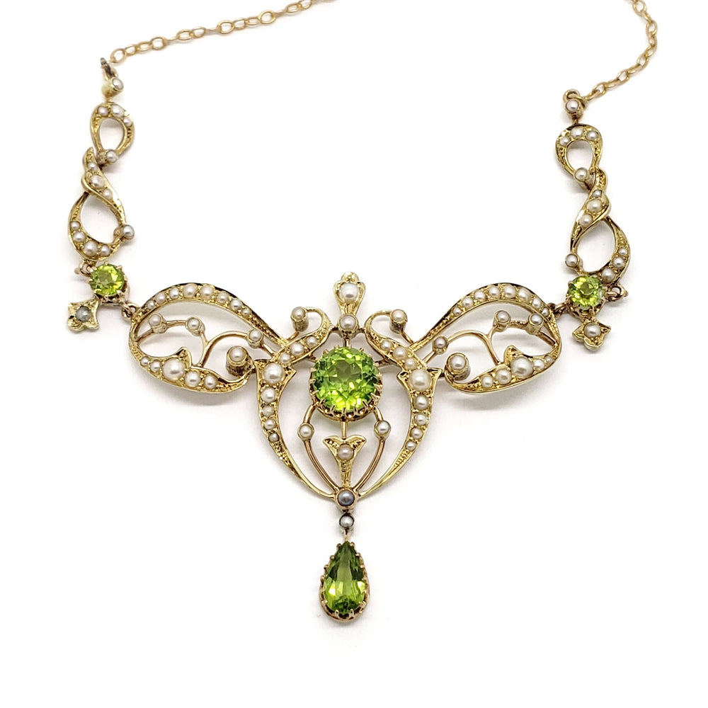 Front view of antique 14kt yellow gold necklace with peridot and seed pearls