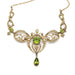 Front view of antique 14kt yellow gold necklace with peridot and seed pearls