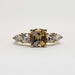 Front view of 14kt yellow gold ring with cushion cut bi-colour sapphire and lab diamonds