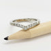 Front view of 14kt white gold chevron wedding ring with pave-set Canadian diamonds on a pencil