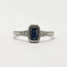 Front view of emerald cut blue Montana sapphire ring in white gold with diamond accents
