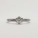 Front view of engraved 14k white gold engagement ring with antique diamond
