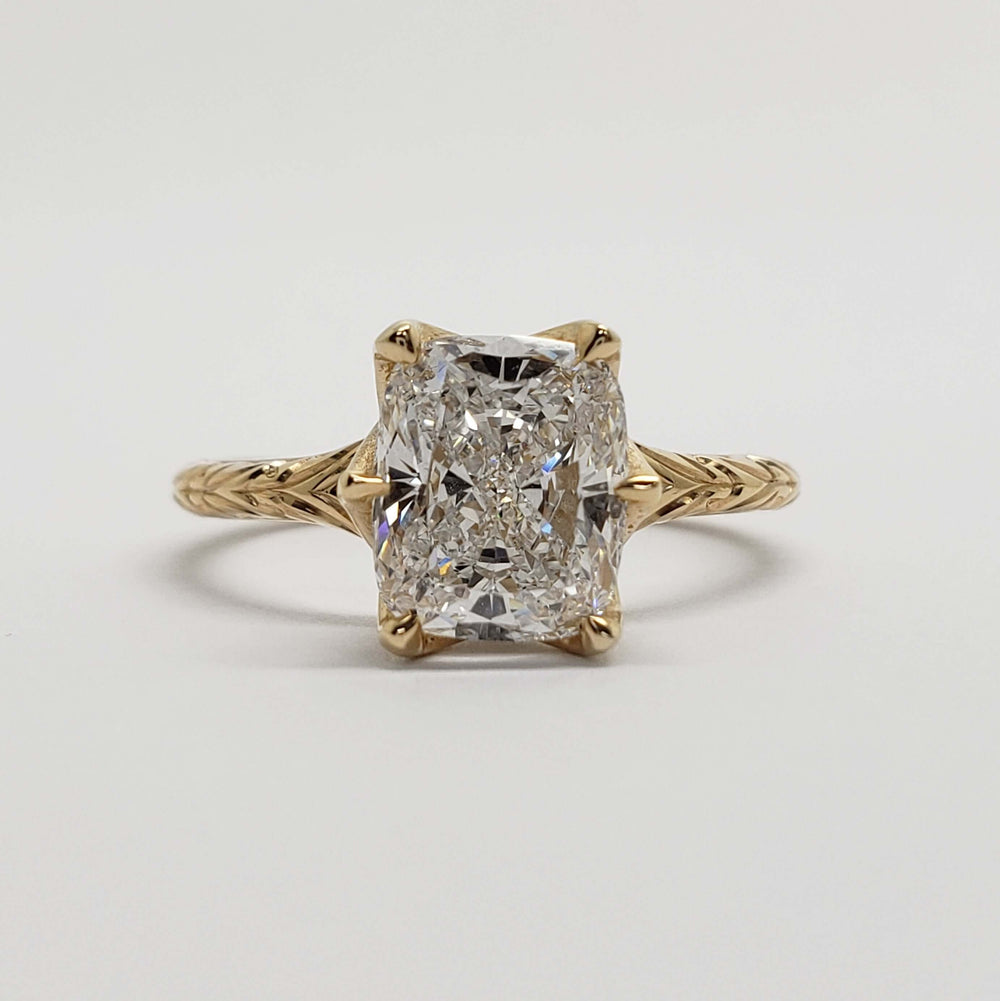 Front view of handcrafted 14kt yellow gold ring with cushion cut lab diamond