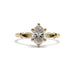 Front view of handcrafted yellow gold ring with oval lab diamond and leaf accents