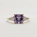 Front view of 14kt yellow gold ring with asscher cut lavender sapphire and pear lab diamonds