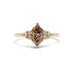 Front view of marquise champagne diamond and accent diamond ring in yellow gold