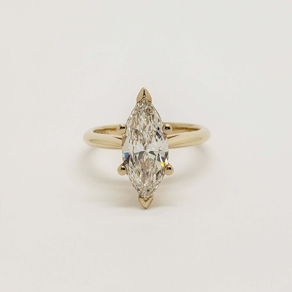 Front view of marquise cut lab-grown diamond ring in 14kt yellow gold