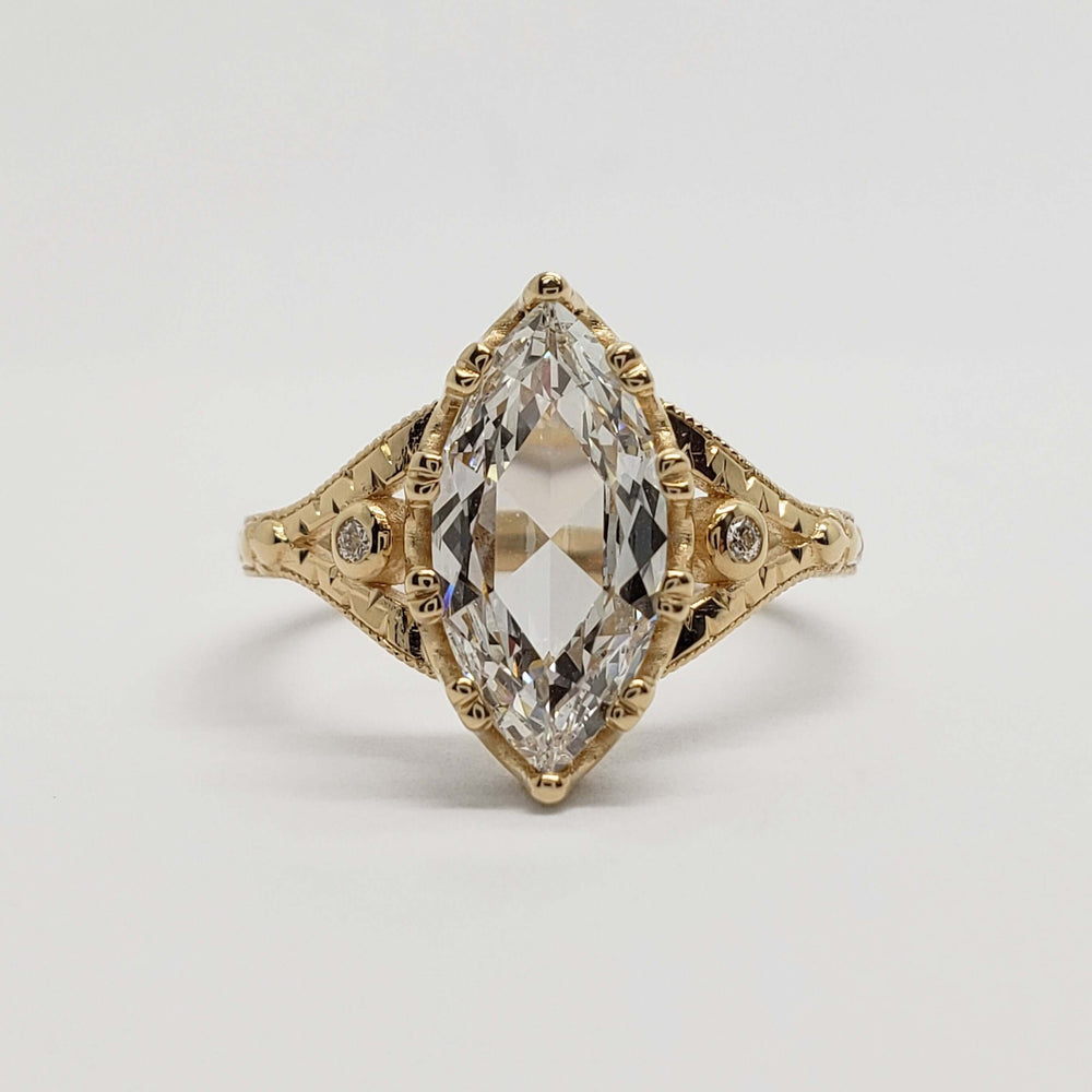 Front view of marquise rose cut lab diamond engagement ring in 14kt yellow gold