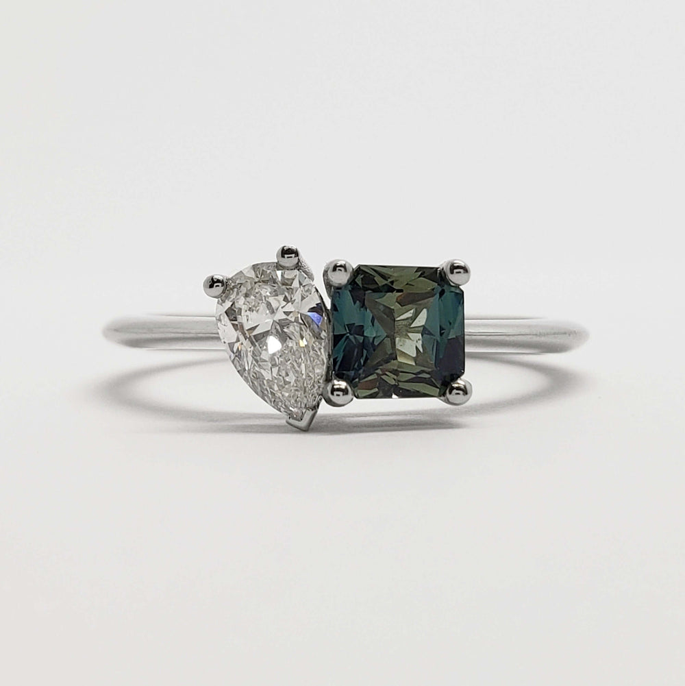 Front view of moi et toi engagement ring with teal Australian sapphire and lab diamond in white gold