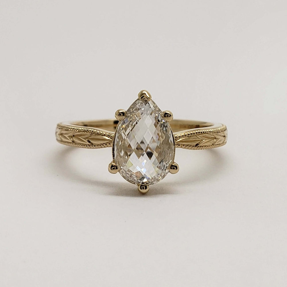 Front view of pear checkerboard lab diamond solitaire ring in 14kt yellow gold