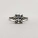 Front view of platinum engagement ring with round lab diamond and pave-set accents