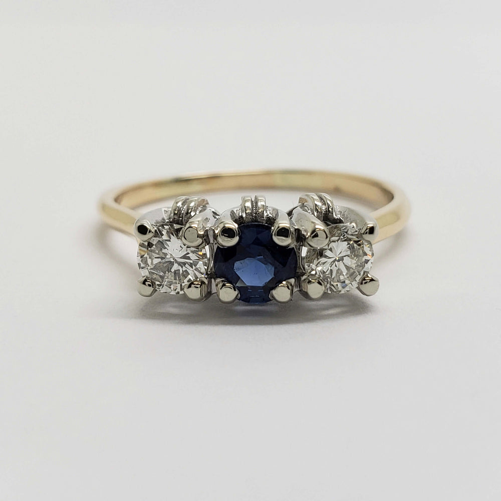 Front view of vintage sapphire and diamond three-stone ring in 14kt gold