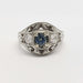 Front view of handcrafted white gold ring with Montana sapphire and Canadian diamonds
