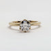 Front view of yellow gold engagement ring with round lab-grown diamond in tulip setting