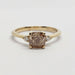 Front view of 14kt yellow gold ring with cushion-cut champagne diamond and side diamonds