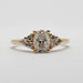 Front view of 14kt yellow gold ring with oval lab diamond and side diamond accents