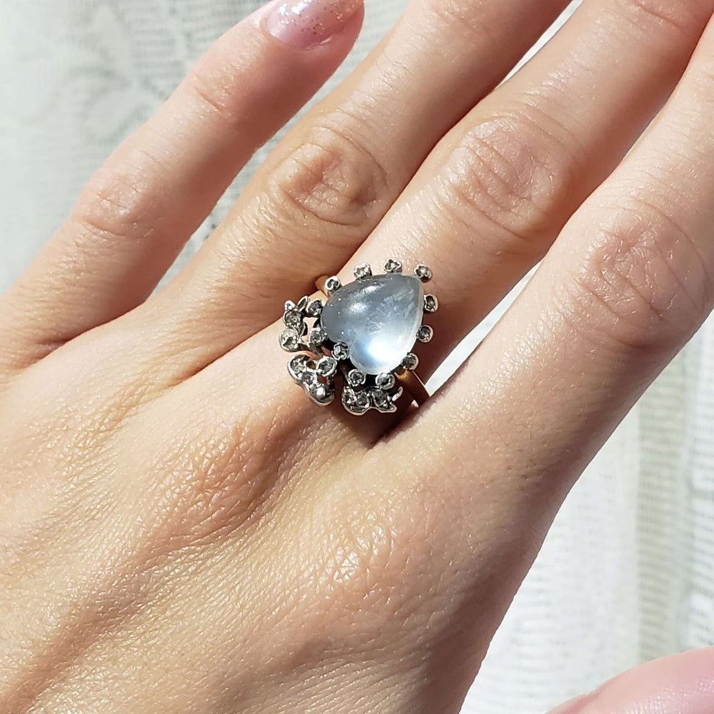 Georgian heart moonstone and diamond ring worn on hand, showing scale and detail