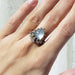 Georgian heart moonstone and diamond ring worn on hand, showing scale and detail