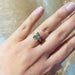 Green sapphire and lab diamond engagement ring in 14kt yellow gold shown on hand