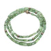 Green tourmaline bead necklace with 14kt white gold beads, shown coiled in a circle