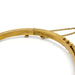 Close-up of 15kt gold hallmarks and clasp on antique seed pearl bangle