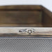 Detail of silver hallmarks stamped inside the antique cigar box