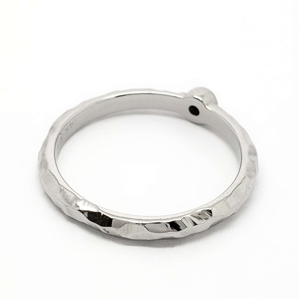 Hammered 14k white gold ring with bezel setting, top view