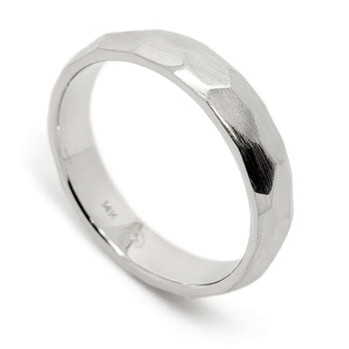Hand-carved 14kt white gold wedding ring with faceted brushed texture