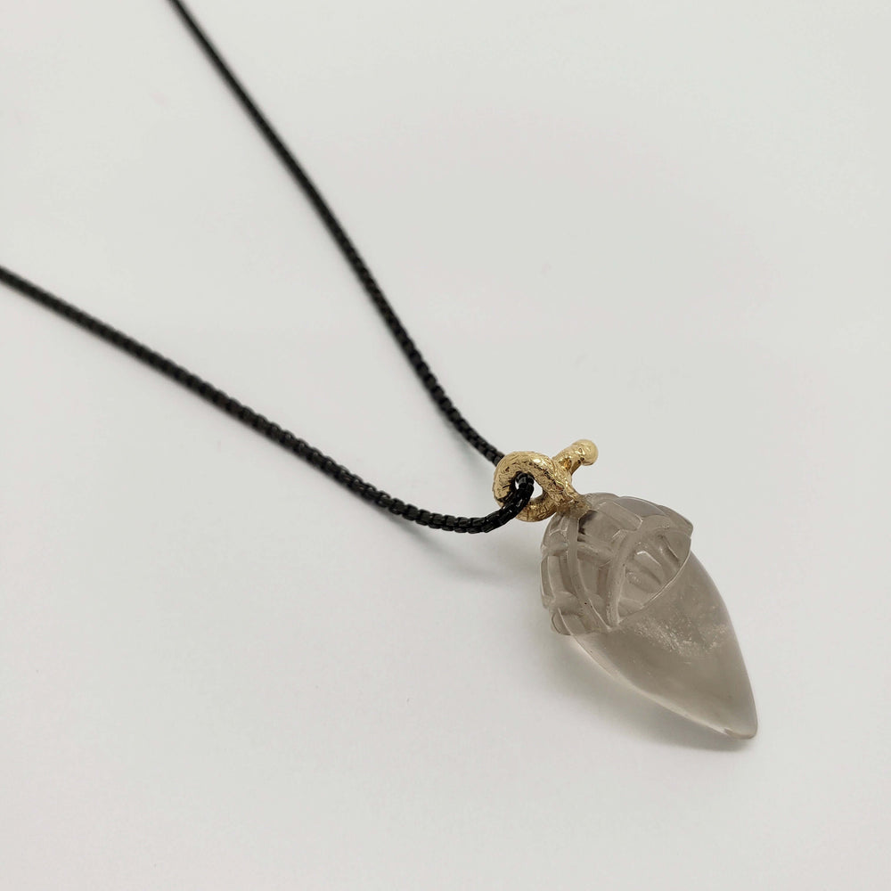 Hand-carved smoky quartz acorn pendant with 14kt yellow gold bail on black chain