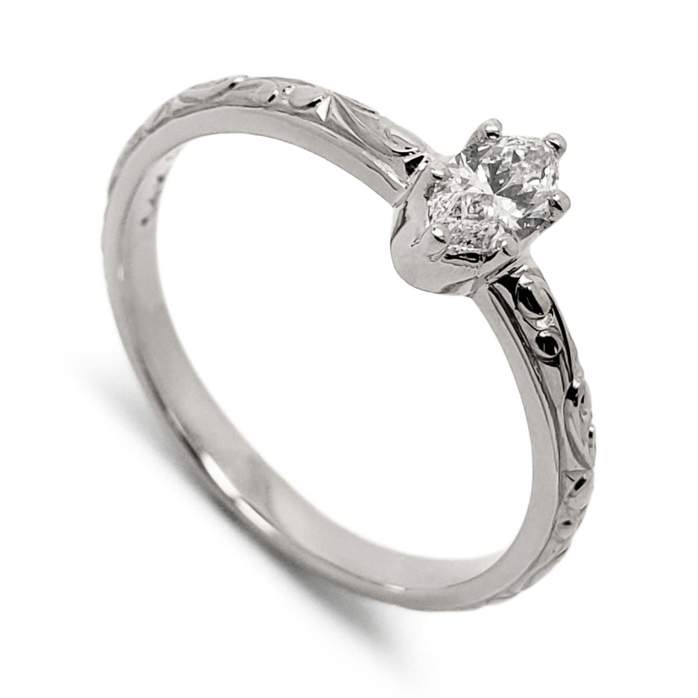 Hand-engraved 14kt white gold ring with marquise lab diamond in six-claw setting