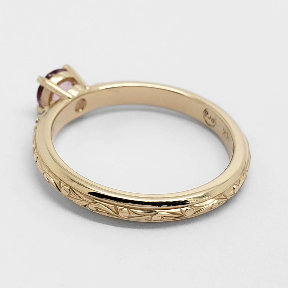 Hand-engraved 14kt yellow gold ring with pink sapphire and diamond accents