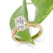 Hand engraved 14kt yellow gold lab diamond ring styled with green leaf