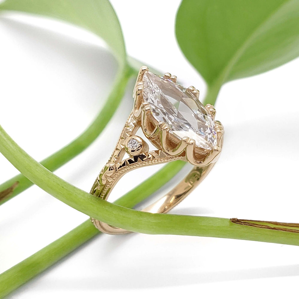 Hand engraved 14kt yellow gold ring with marquise lab diamond and side Canadian diamonds