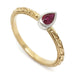 Hand engraved 14kt yellow gold ring with pear-shaped ruby in white gold bezel