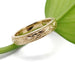 Hand engraved 14kt yellow gold wedding band with floral and leaf details