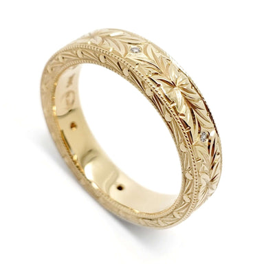 Hand engraved 14kt yellow gold wedding ring with Canadian diamonds, floral motif and millgrain edge