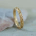 Hand engraved 14kt yellow gold wedding ring with curl and bead pattern, millgrain detail