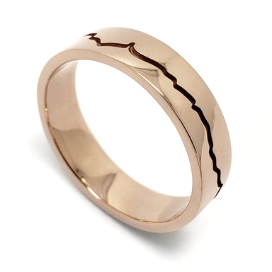 Handcrafted 14k rose gold wedding ring with mountain range engraving, high polished finish