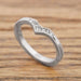 Handcrafted 14k white gold chevron ring with pave Canadian diamonds on wood background