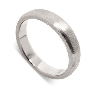 Handcrafted 14k white gold flat wedding ring with brushed finish on white background