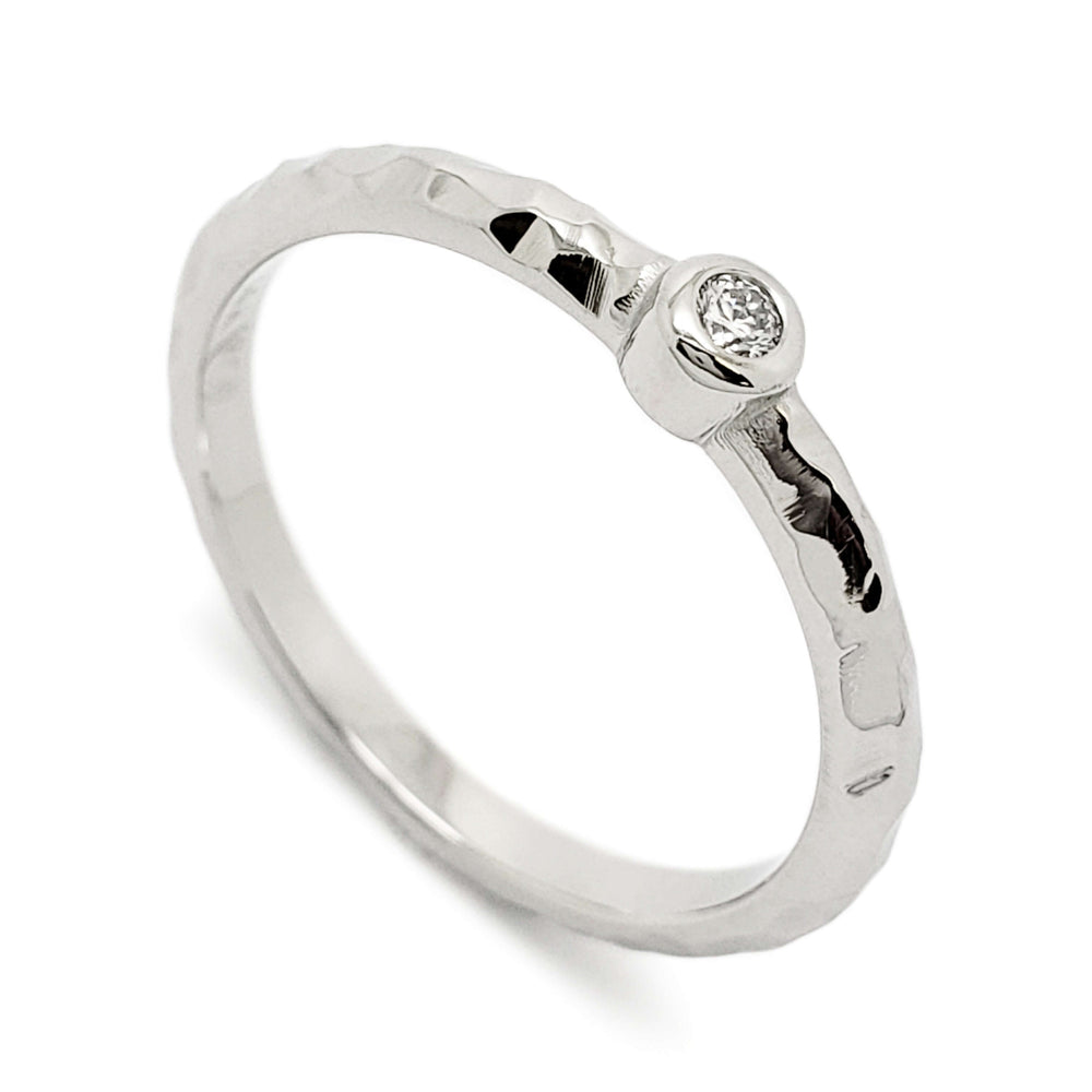 Handcrafted 14k white gold hammered ring with bezel-set Canadian diamond