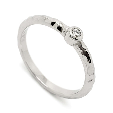 Handcrafted 14k white gold hammered ring with bezel-set Canadian diamond